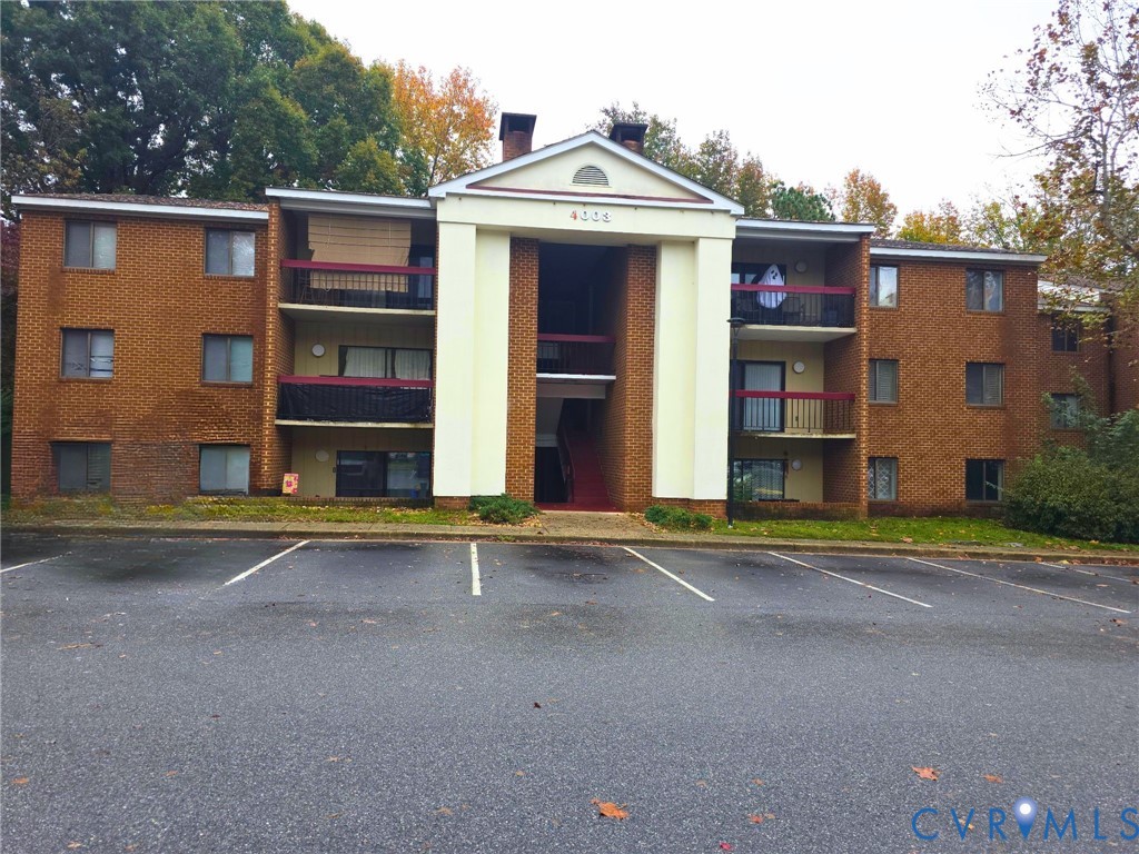 4003 Governors Square, Unit 8 Williamsburg, VA 23188 - Photo 1 of 27 a view of a building with a street