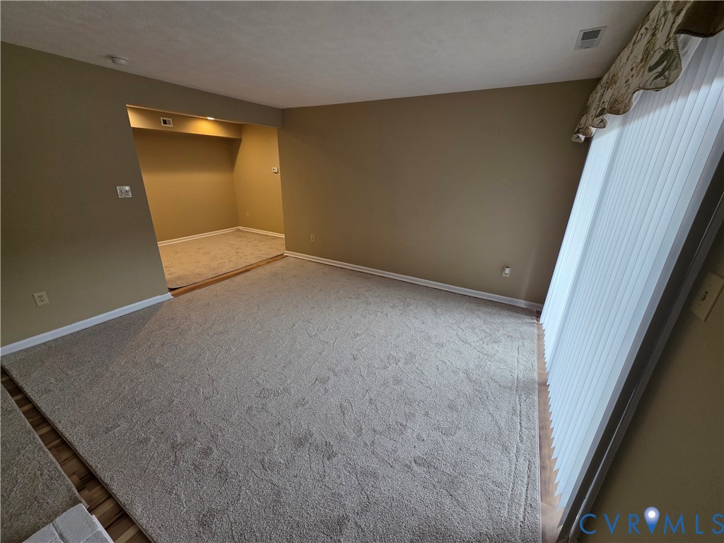 4003 Governors Square, Unit 8 Williamsburg, VA 23188 - Photo 11 of 27 an empty room with a door