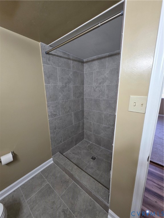 4003 Governors Square, Unit 8 Williamsburg, VA 23188 - Photo 20 of 27 a bathroom with a glass shower door