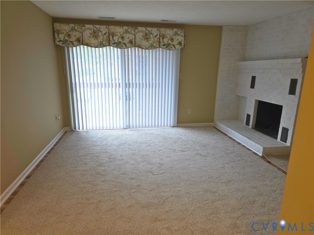 4003 Governors Square, Unit 8 Williamsburg, VA 23188 - Photo 2 of 27 an empty room with windows