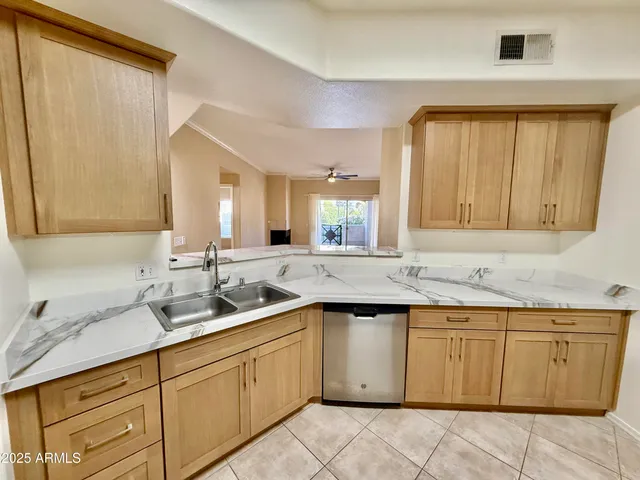 a kitchen with a sink and cabinets