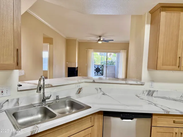 a kitchen with a sink and a window