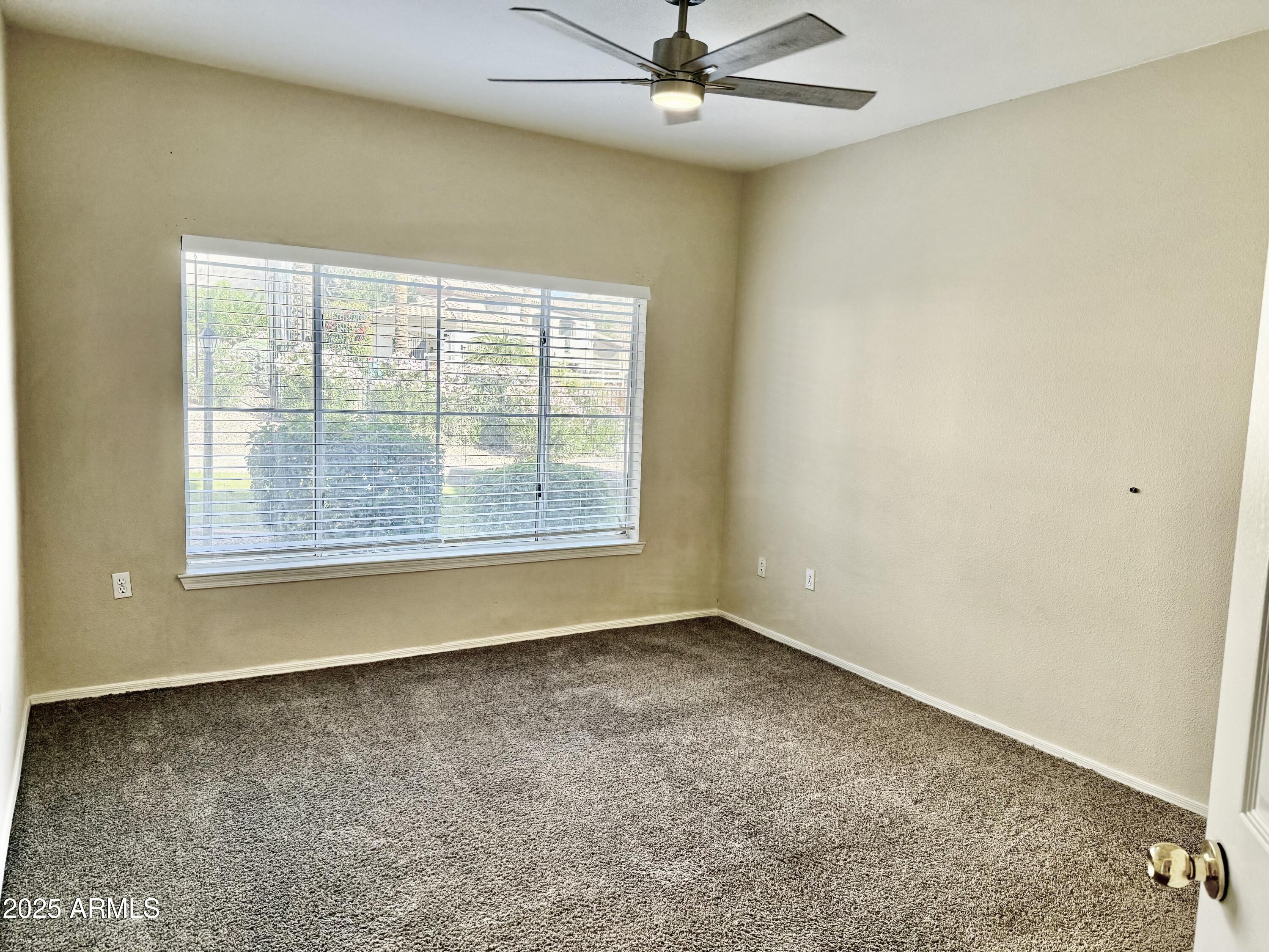 3236 East Chandler Boulevard, Unit 1071 Phoenix, AZ 85048 - Photo 20 of 35 an empty room with a window