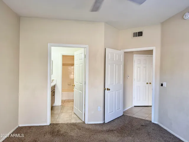 a view of a livingroom with a walk in closet and living room