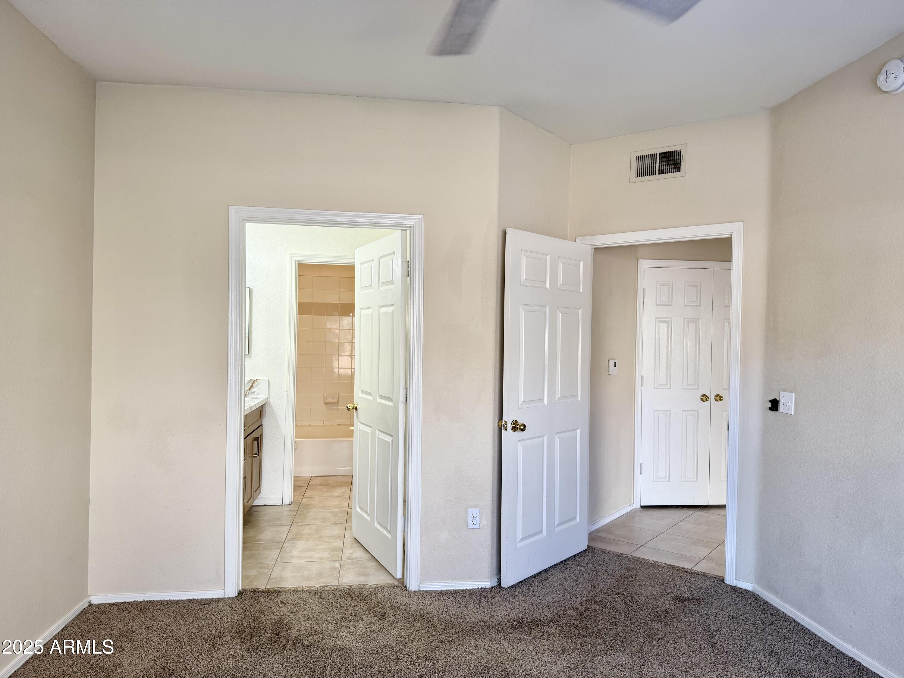 3236 East Chandler Boulevard, Unit 1071 Phoenix, AZ 85048 - Photo 21 of 35 a view of a livingroom with a walk in closet and living room
