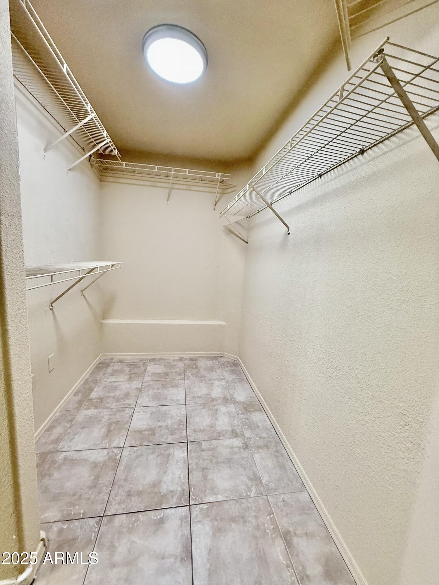 3236 East Chandler Boulevard, Unit 1071 Phoenix, AZ 85048 - Photo 23 of 35 a view of a room with racks on the wall