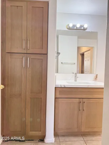 a bathroom with a mirror and a sink