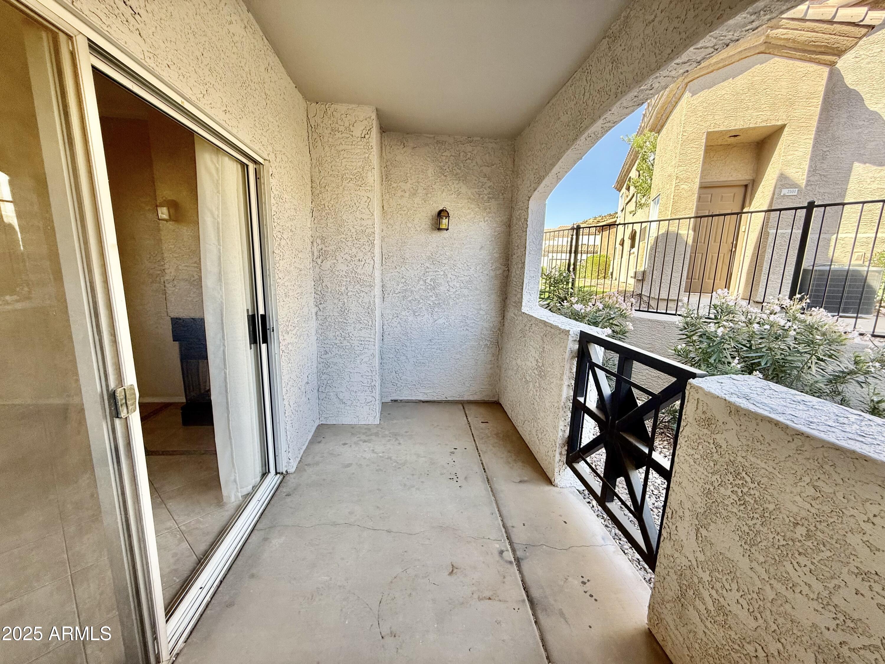 3236 East Chandler Boulevard, Unit 1071 Phoenix, AZ 85048 - Photo 33 of 35 a view of a hallway with wooden floor and glass door