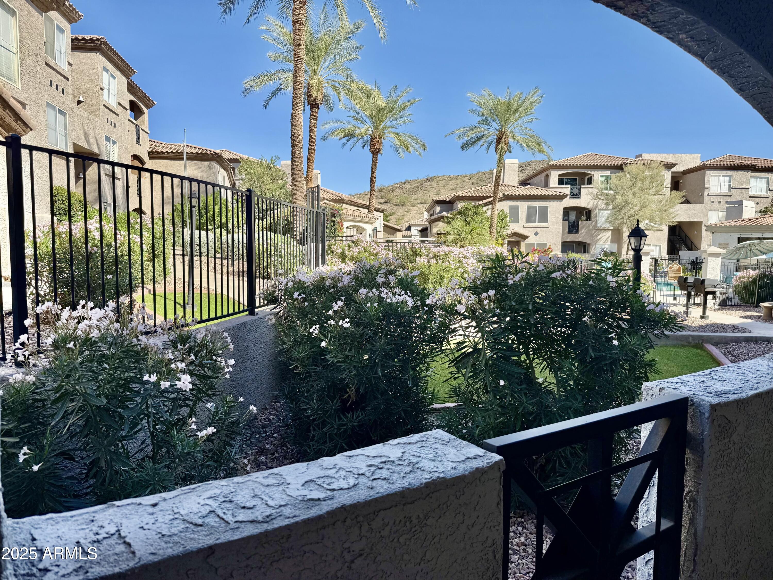 3236 East Chandler Boulevard, Unit 1071 Phoenix, AZ 85048 - Photo 34 of 35 a view of a house with a street