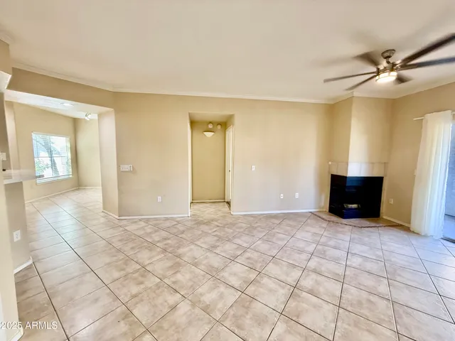 a view of a livingroom with wooden floor and a cabinet