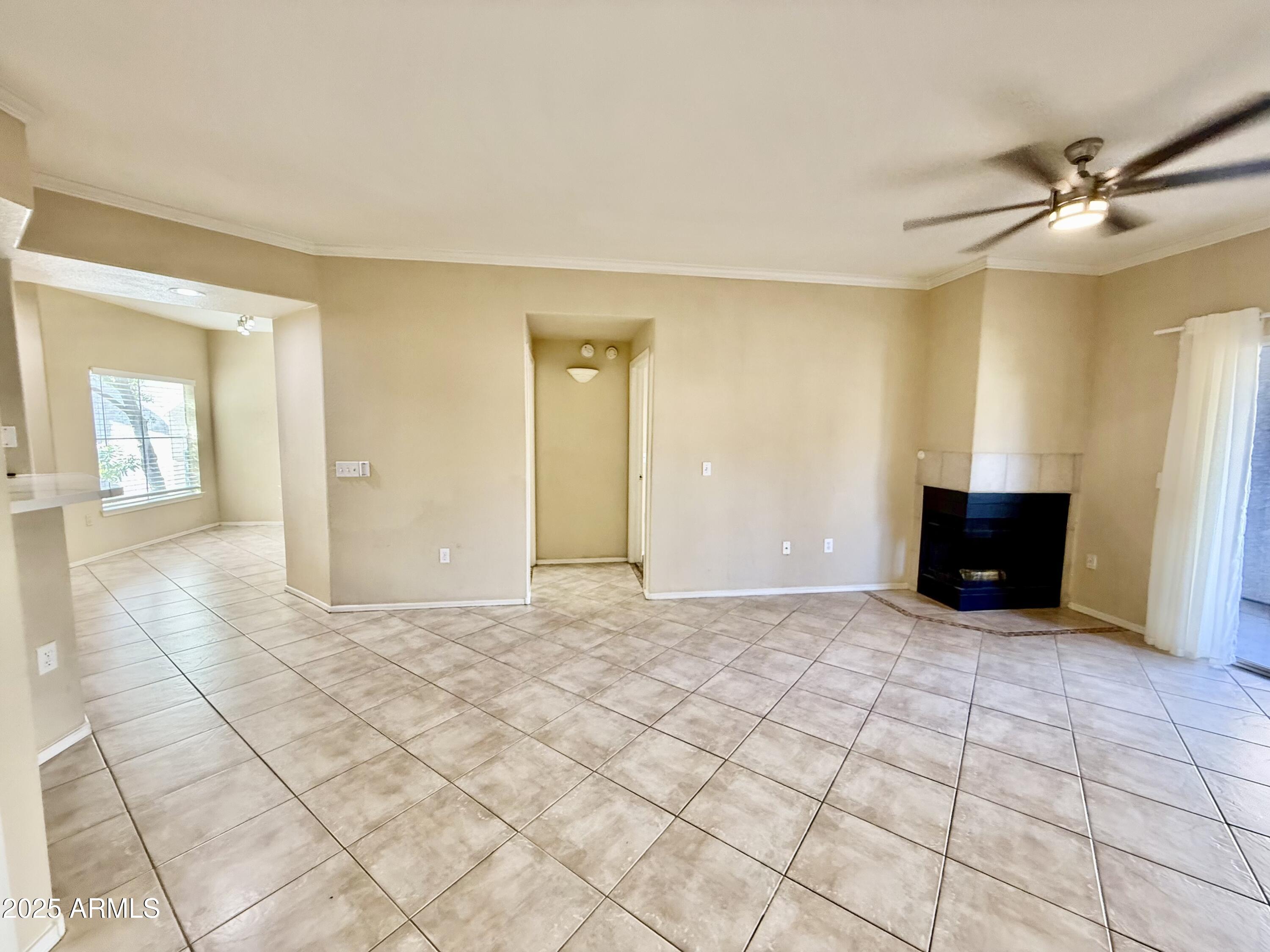3236 East Chandler Boulevard, Unit 1071 Phoenix, AZ 85048 - Photo 9 of 35 a view of a livingroom with wooden floor and a cabinet