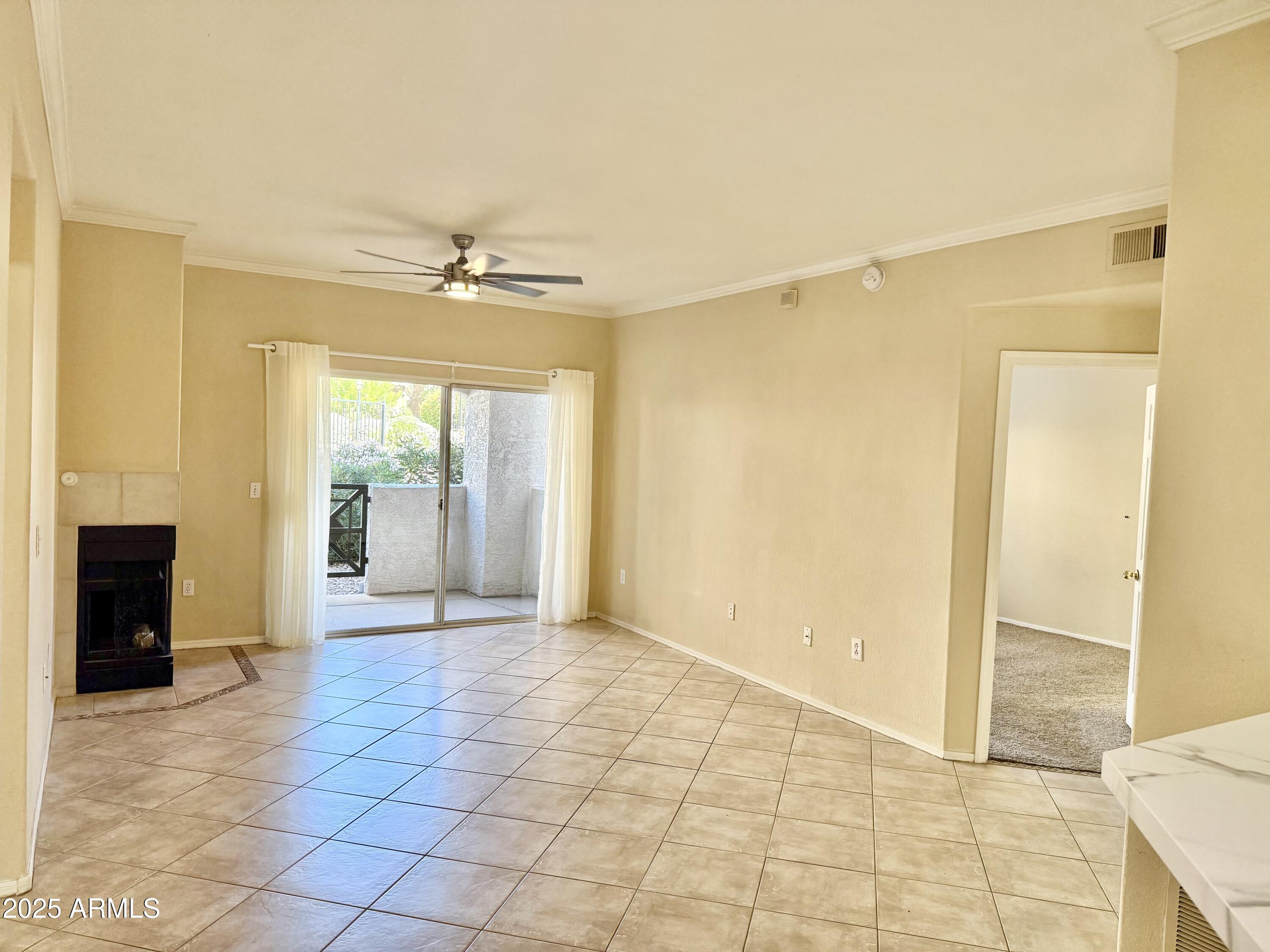 3236 East Chandler Boulevard, Unit 1071 Phoenix, AZ 85048 - Photo 10 of 35 a view of a livingroom with a chandelier