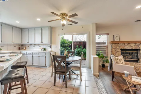 a kitchen with a table chairs and a stove