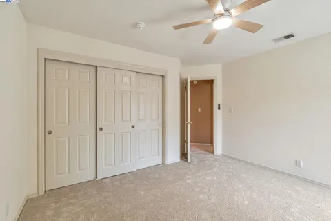 an empty room with closet area