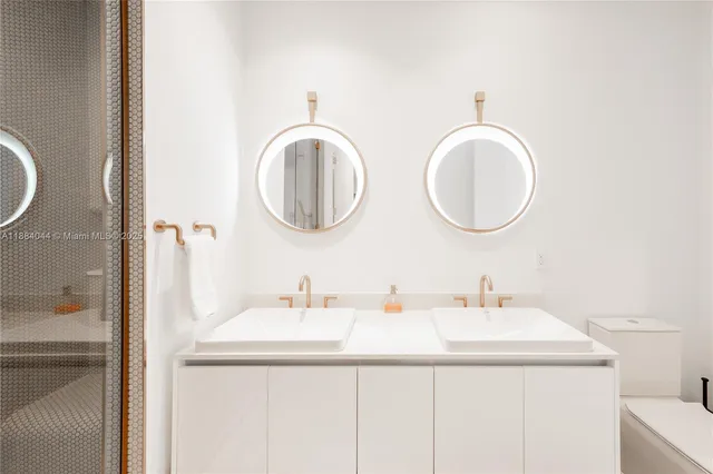 a spacious bathroom with a tub sink and mirror