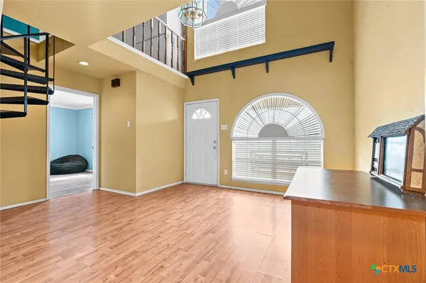 a view of a hallway view with staircase