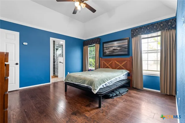 a bedroom with a bed and window