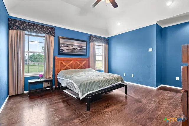 a bathroom with a double vanity sink mirror and shower