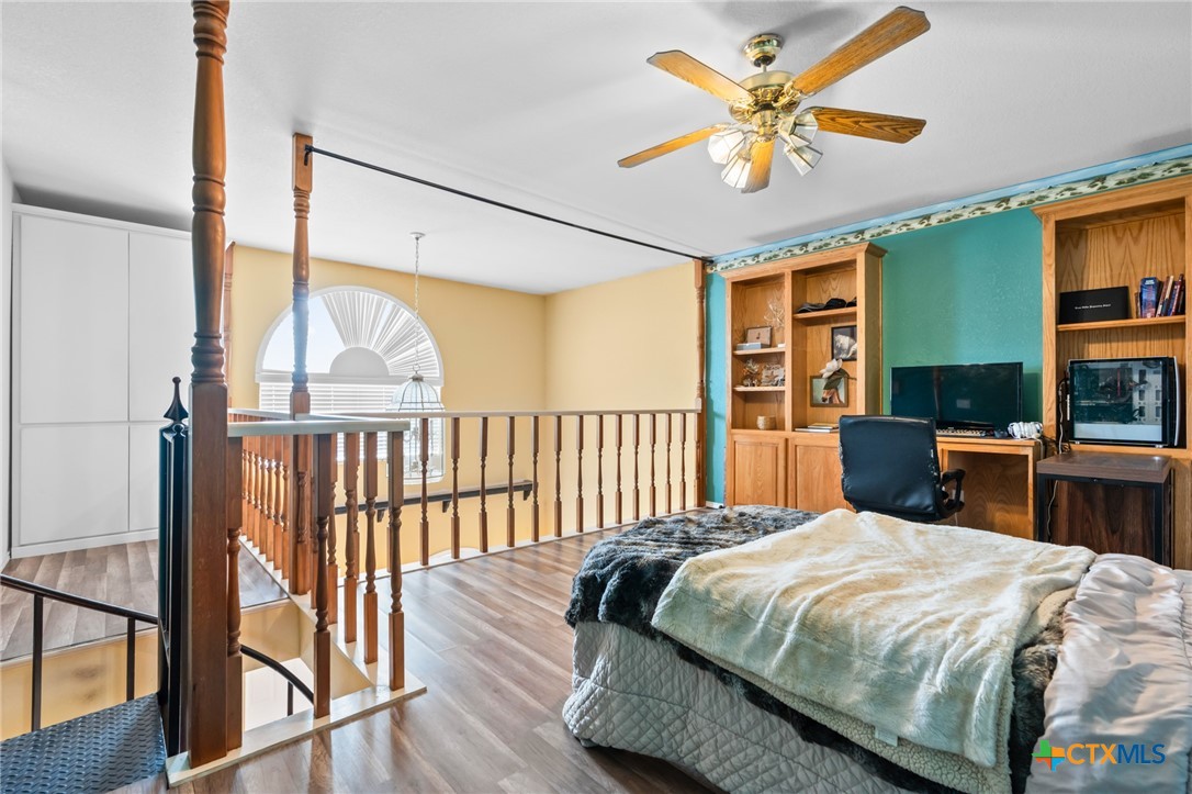 411 Wade Road Eddy, TX 76524 - Photo 38 of 48 a bed sitting in a bedroom next to a window