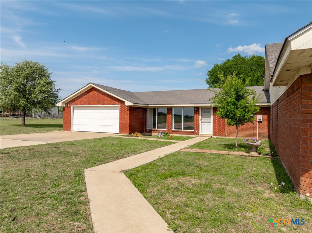 411 Wade Road Eddy, TX 76524 - Photo 7 of 48 a front view of a house with a yard