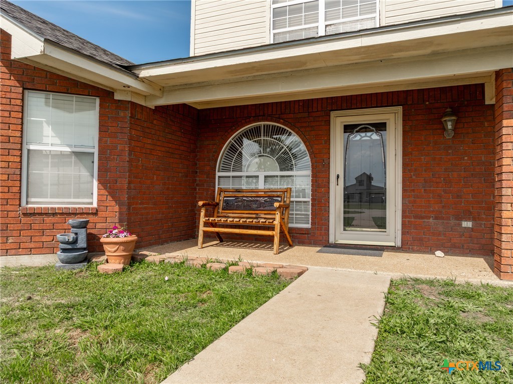 411 Wade Road Eddy, TX 76524 - Photo 8 of 48 a front view of a house with garden