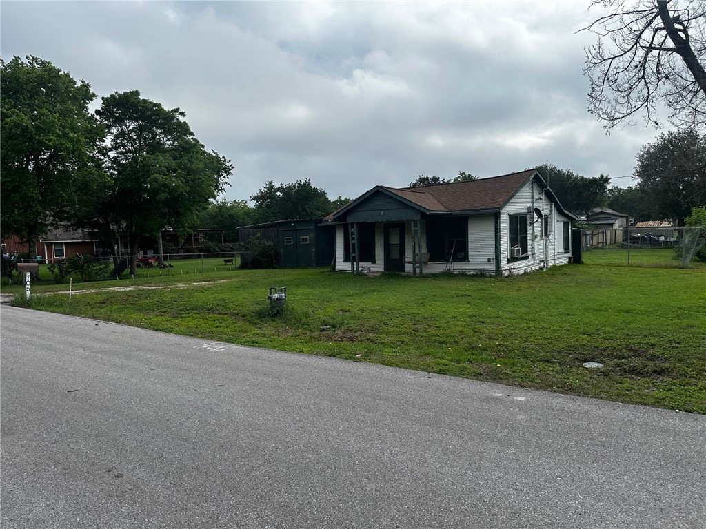 705 Mesquite Street Bryan, TX 77803 - Photo 2 of 9 a view of a house with a big yard and large trees
