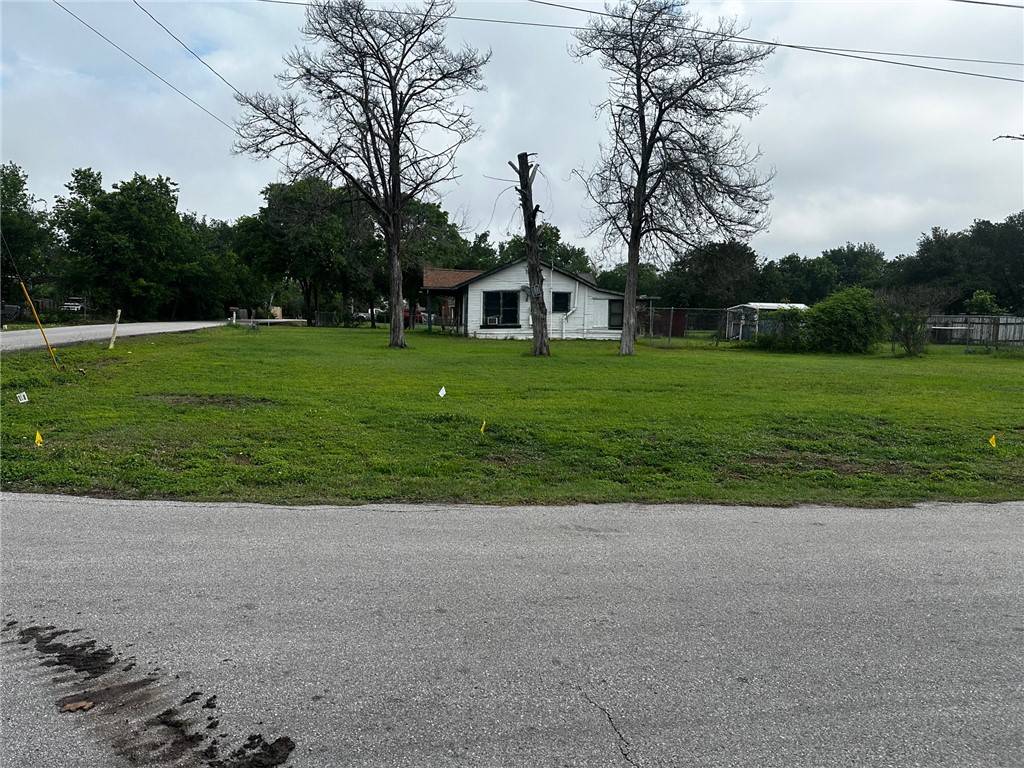 705 Mesquite Street Bryan, TX 77803 - Photo 7 of 9 a front view of a house with a yard