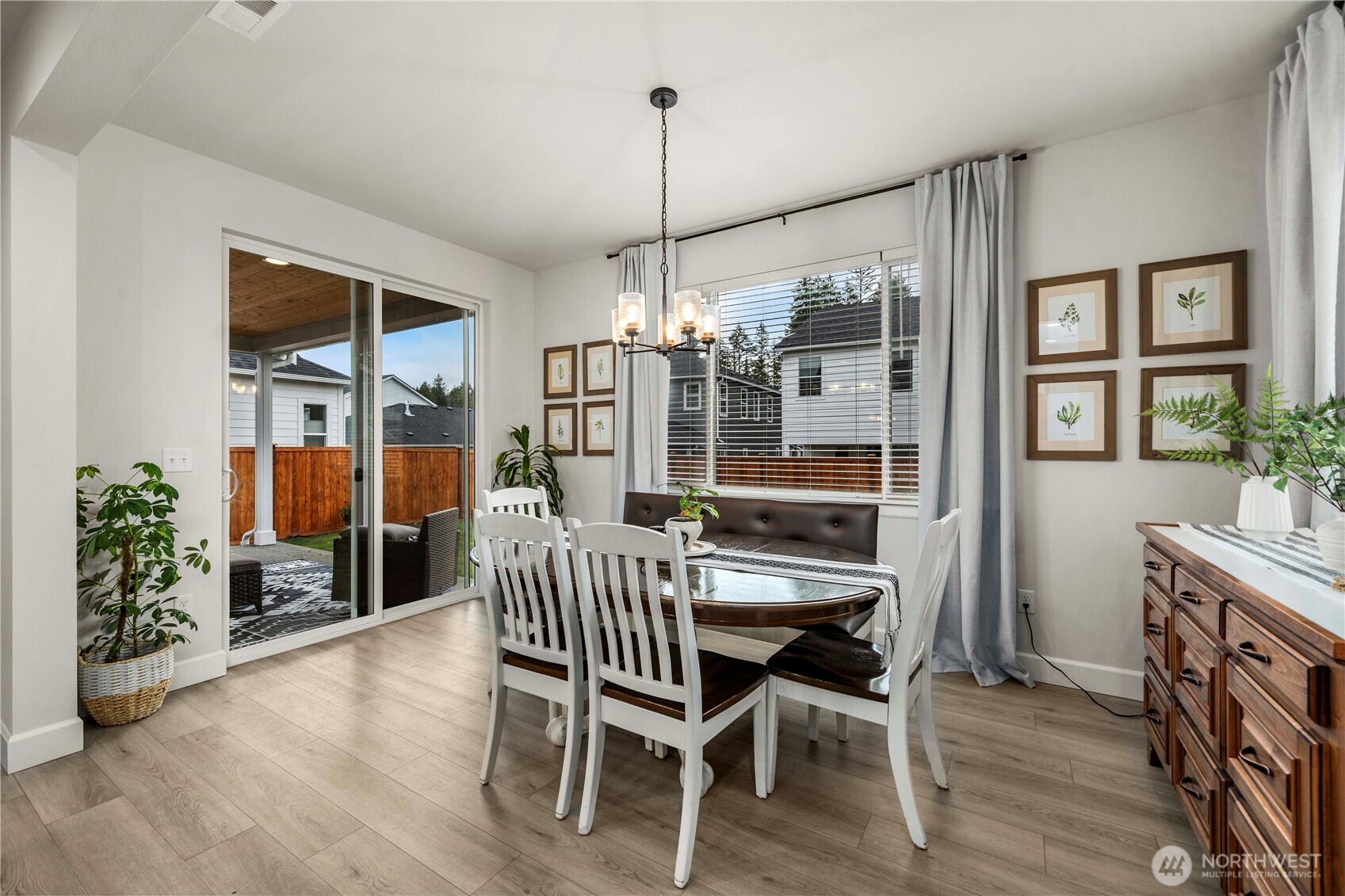 6209 Marymere Rd Port Orchard Southwest Port Orchard, WA 98367 - Photo 11 of 34 a dining room with furniture and wooden floor