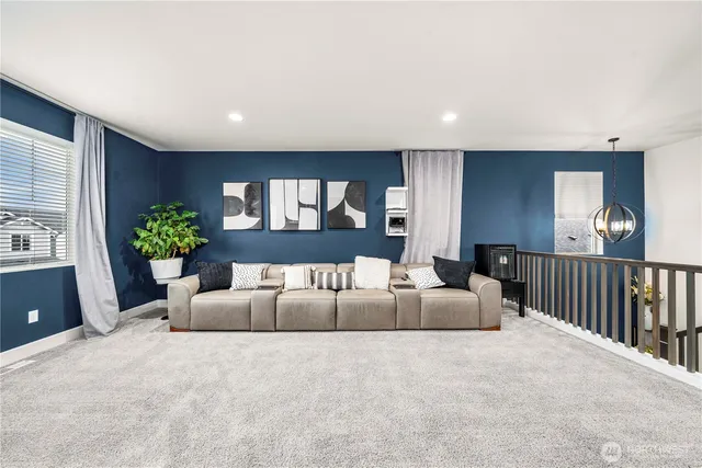 a bedroom with a bed and a television