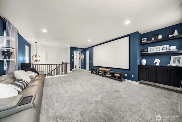 a bedroom with a bed and a flat screen television