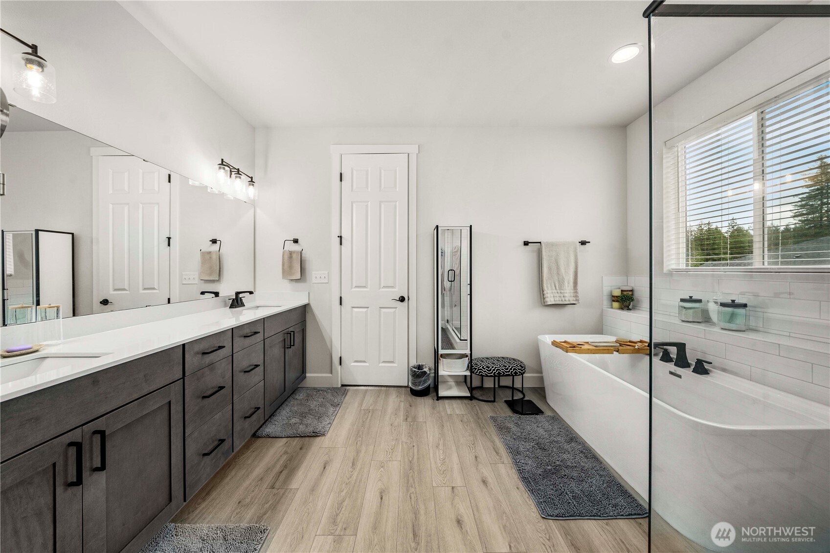 6209 Marymere Rd Port Orchard Southwest Port Orchard, WA 98367 - Photo 22 of 34 a spacious bathroom with a double vanity sink a mirror and a bathtub