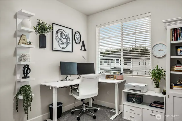 a bathroom with a toilet a sink and a window