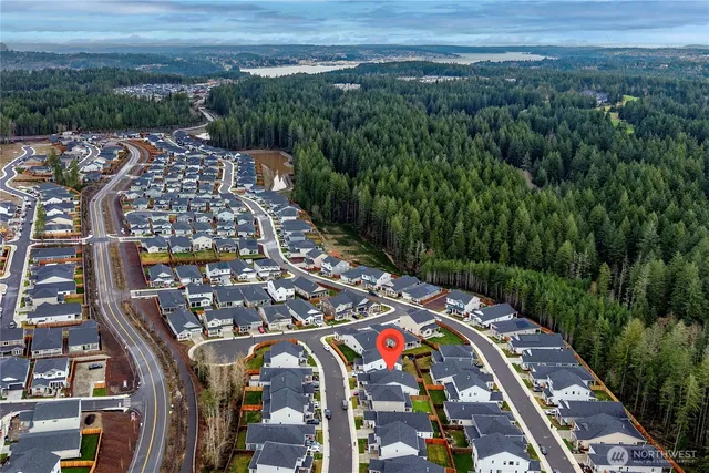 a view of a house with a yard and porch