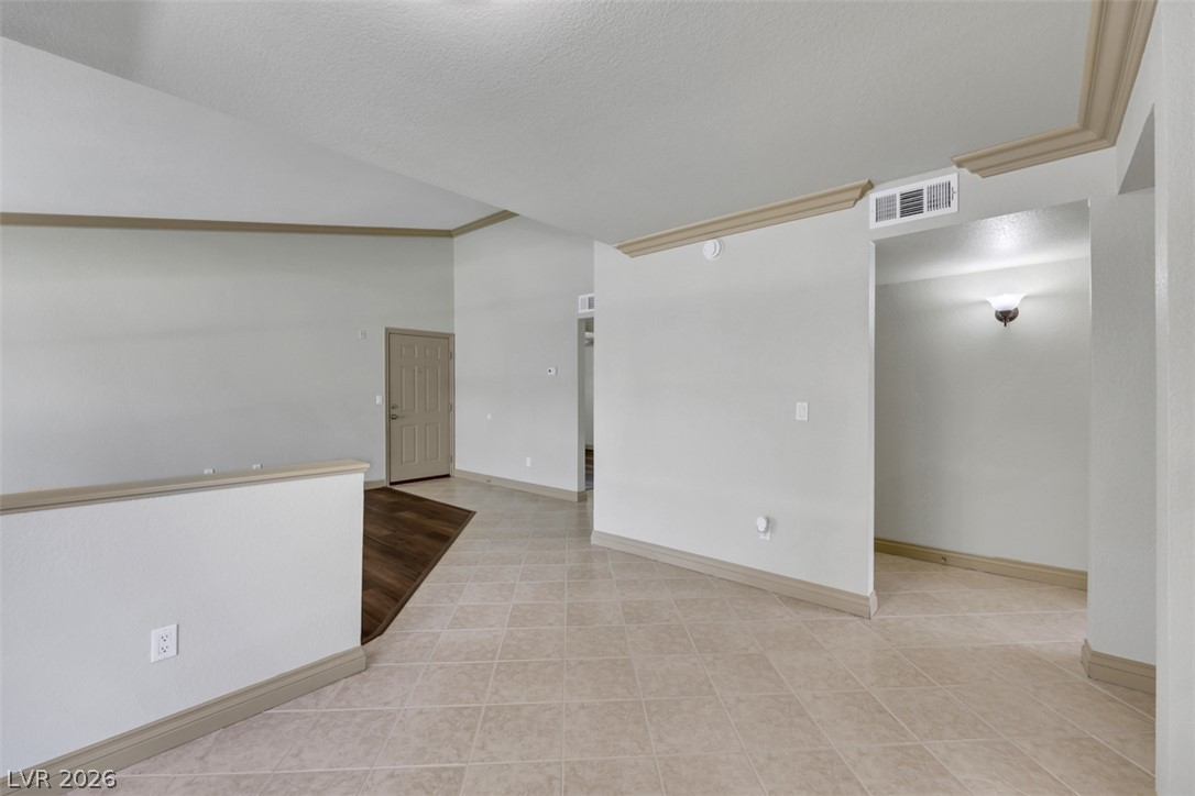 8101 West Flamingo Road, Unit 2136 Las Vegas, NV 89147 - Photo 13 of 32 An open entry foyer highlights durable tile flooring and clean vaulted ceilings.