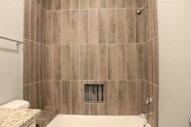 a bathroom with a sink and a toilet