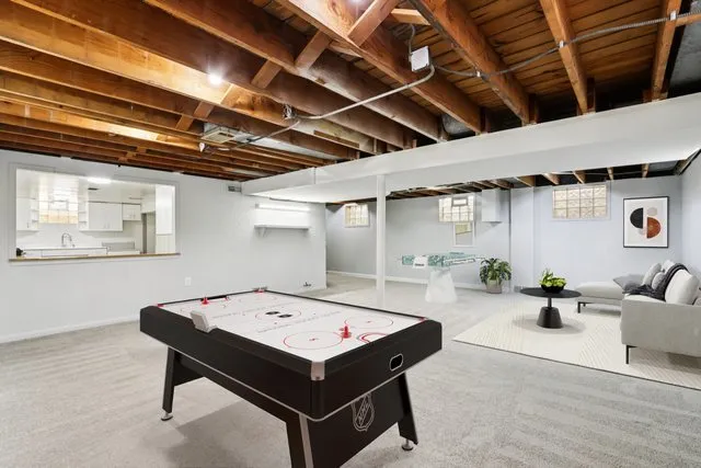 a living room with furniture and white walls