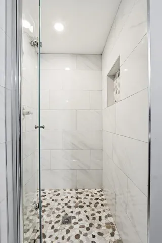 a bathroom with a shower and a toilet