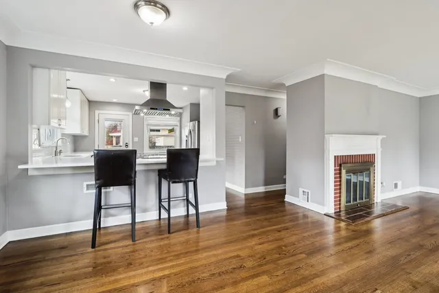 a view of a livingroom with furniture and wooden floor