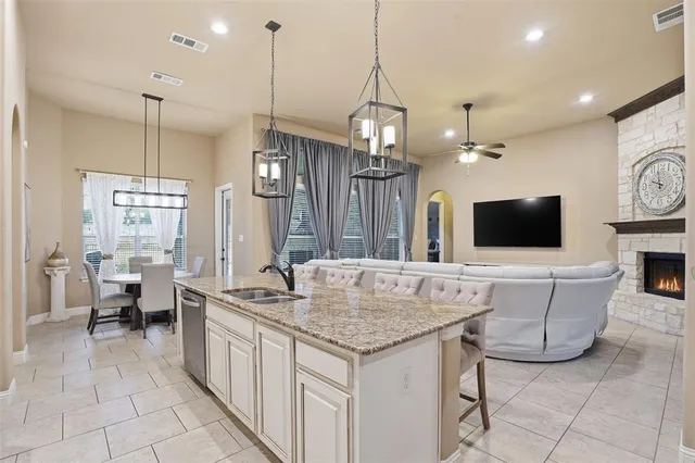 a living room with fireplace furniture and a flat screen tv