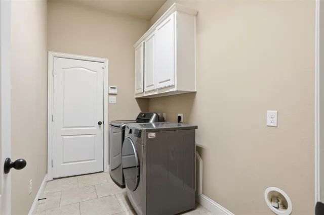 a room with a stove and a refrigerator