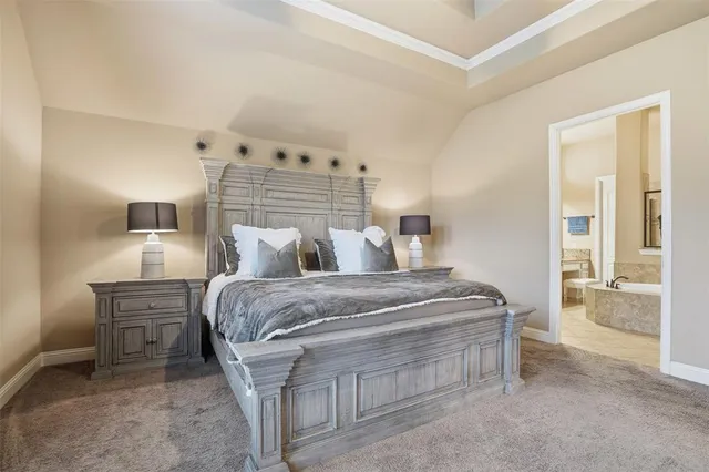 a bed room with furniture and a table