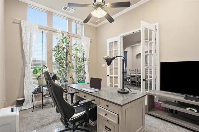 a view of a livingroom with furniture and a flat screen tv