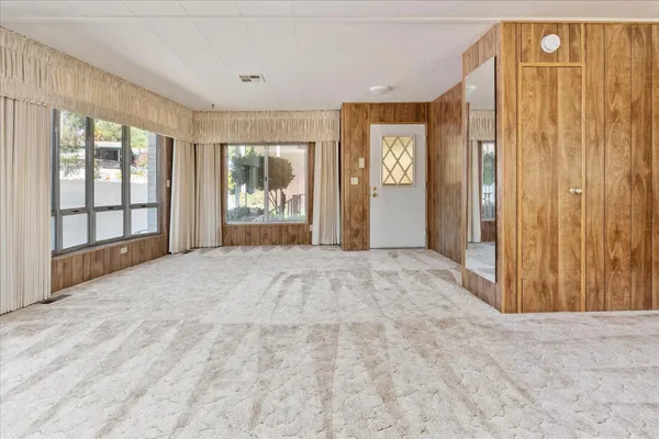 a view of an empty room with a window