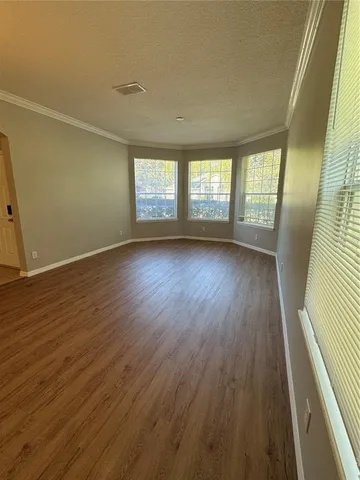 a large kitchen with a stove a sink dishwasher and a refrigerator