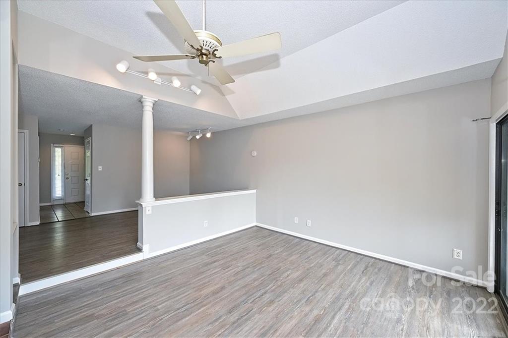 226 Queens Road, Unit 78 Charlotte, NC 28204 - Photo 18 of 32 wooden floor in an empty room with a window