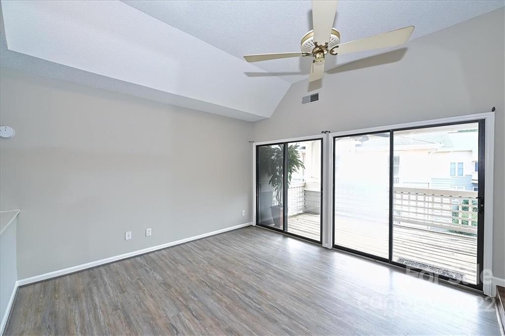 226 Queens Road, Unit 78 Charlotte, NC 28204 - Photo 19 of 32 a view of an empty room with a window