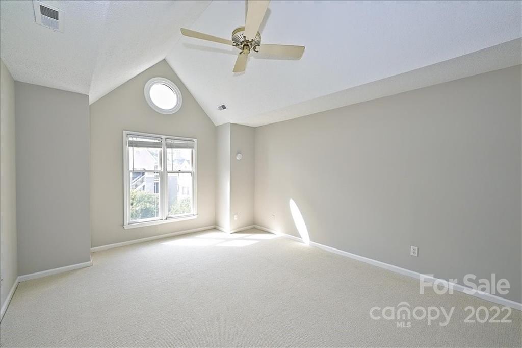 226 Queens Road, Unit 78 Charlotte, NC 28204 - Photo 20 of 32 a view of an empty room with a window