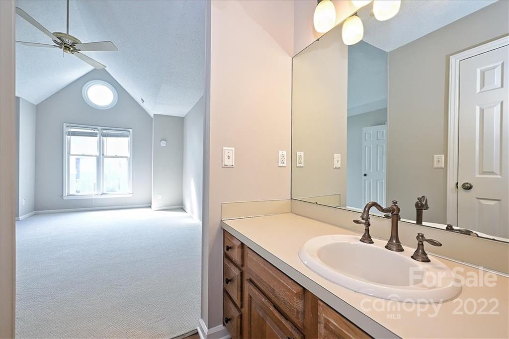 226 Queens Road, Unit 78 Charlotte, NC 28204 - Photo 24 of 32 a bathroom with a sink and a mirror
