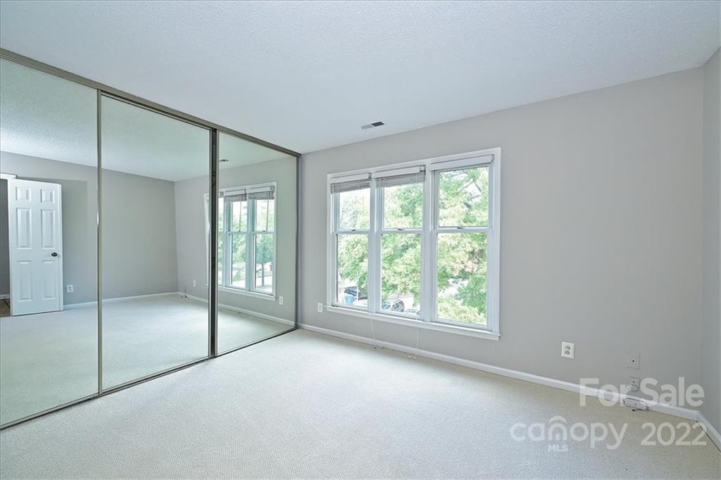 226 Queens Road, Unit 78 Charlotte, NC 28204 - Photo 27 of 32 a view of an empty room with glass door