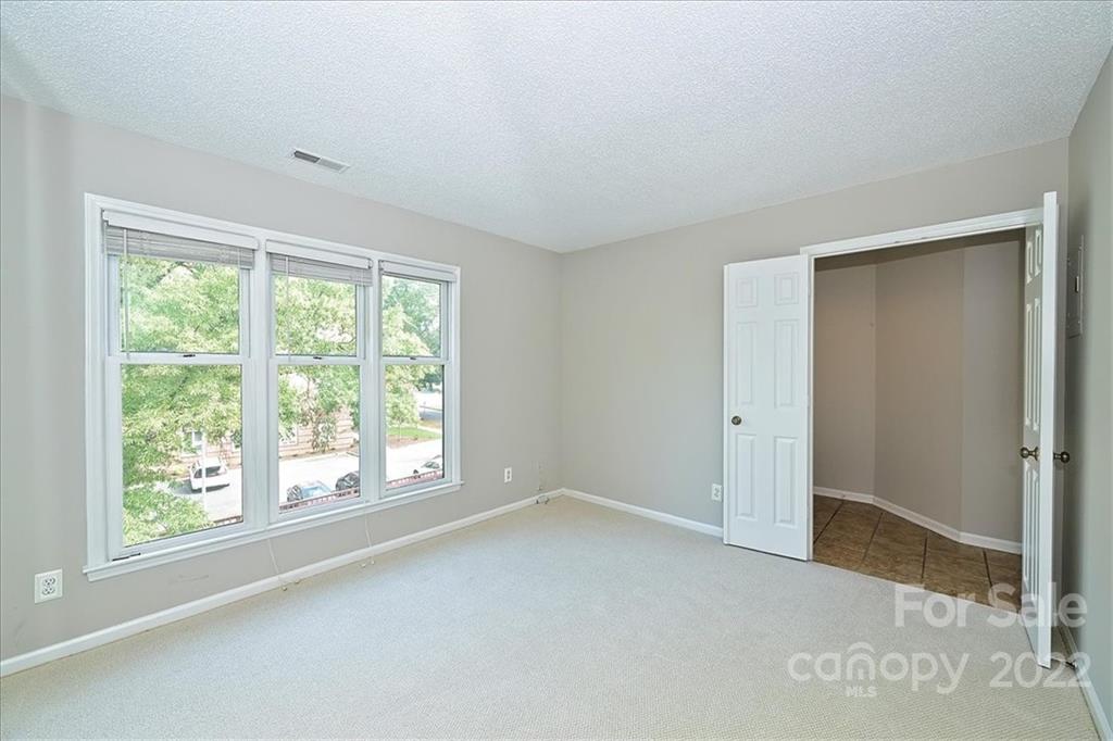 226 Queens Road, Unit 78 Charlotte, NC 28204 - Photo 28 of 32 a view of an empty room with a window